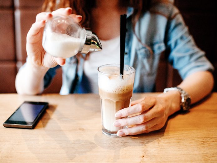 Pouring Sugar in The Coffee