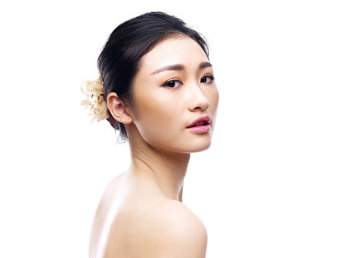 studio portrait of young asian woman