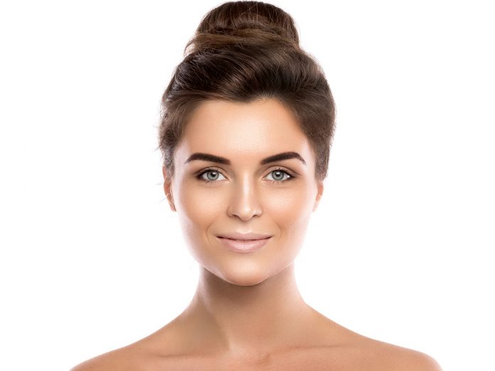 Beautiful young woman on white background