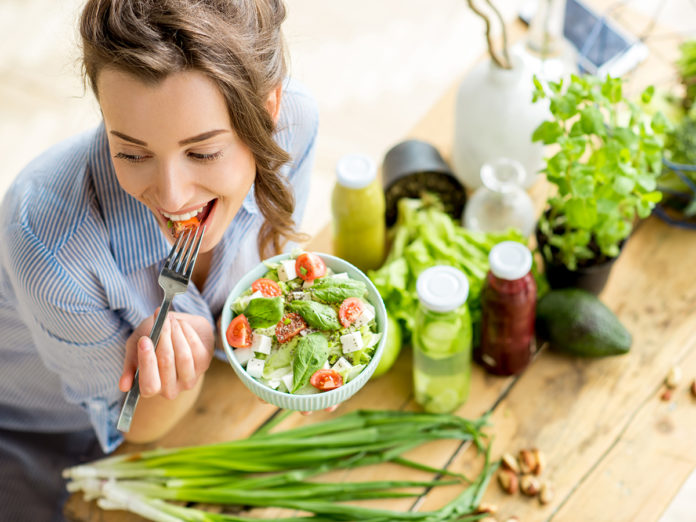 Woman eating healthy salad