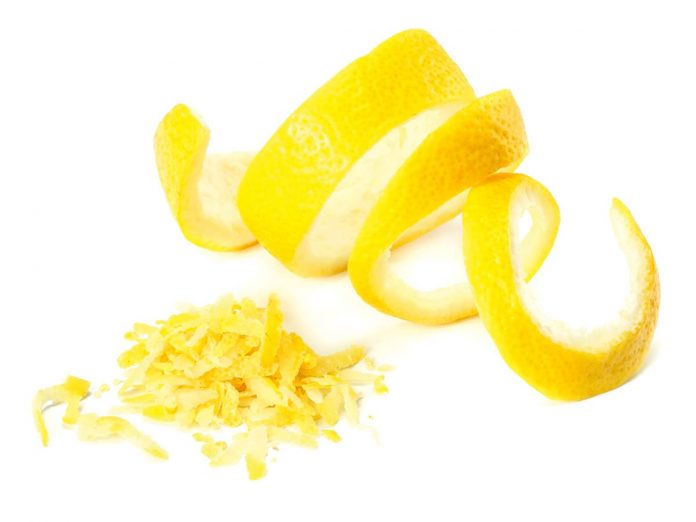 fresh lemon peel and lemon zest isolated on white background. he