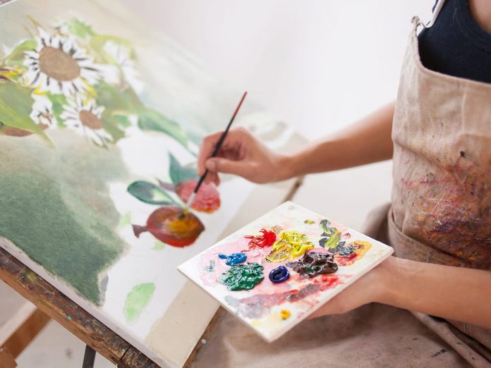 Female artist working in studio