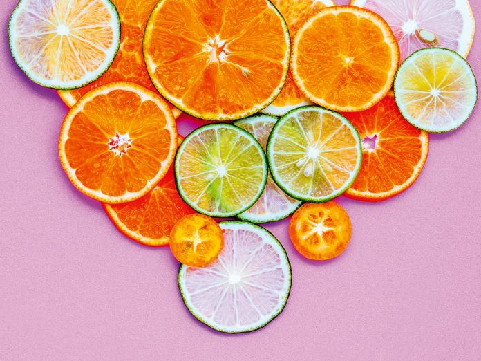 Healthy foods and medicine concept. Pill of vitamin C and variou