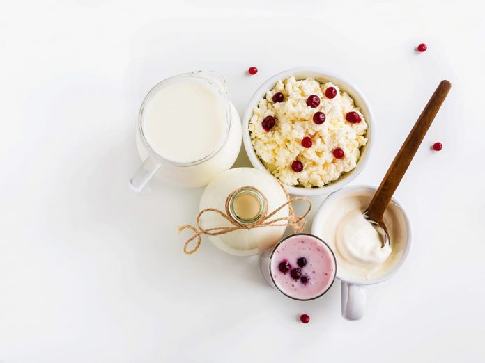 Dairy produce, white table, top view.